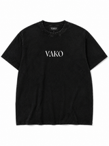 A black short-sleeve crewneck t-shirt with 'VAKO' printed in white serif letters across the chest, displayed flat against a white background.